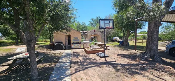 a view of a backyard with sitting area