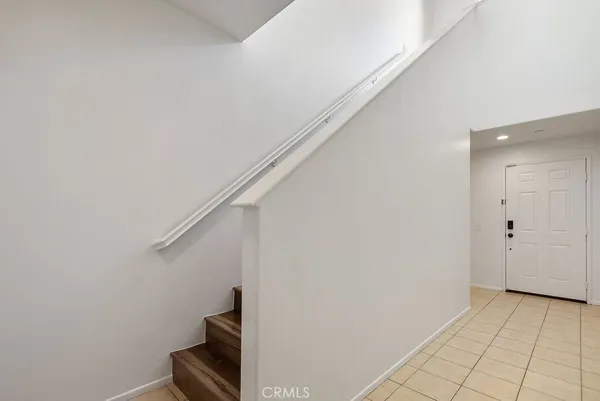 a view of a hallway with staircase