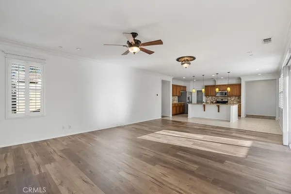 a view of a livingroom with a furniture wooden floor and window