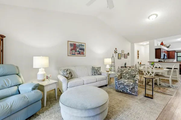 a view of a balcony with chair and floor to ceiling window
