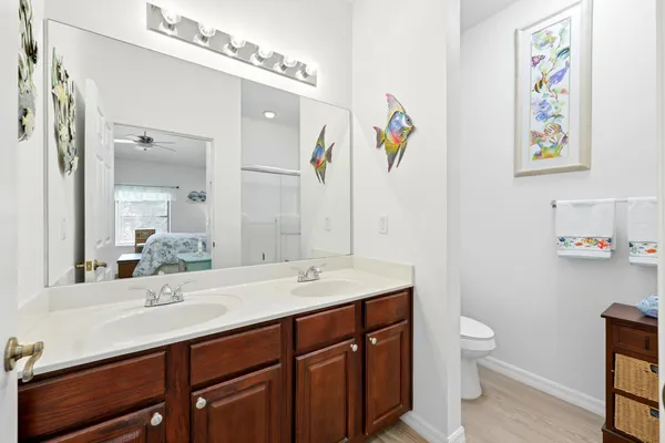 a dining room with stainless steel appliances kitchen island granite countertop a table chairs and a view of kitchen