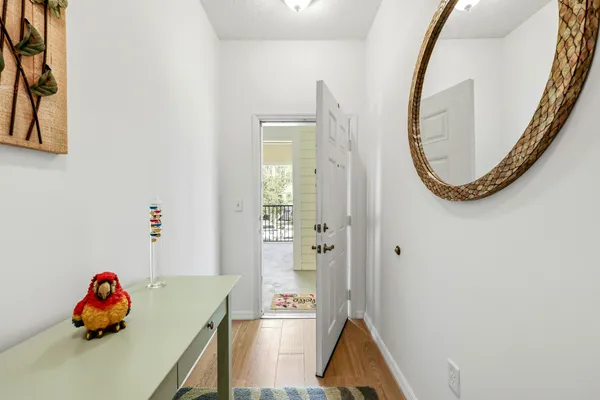 a dining room with furniture a rug and wooden floor
