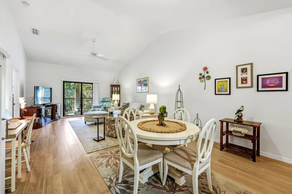 a living room with furniture and painting on the wall