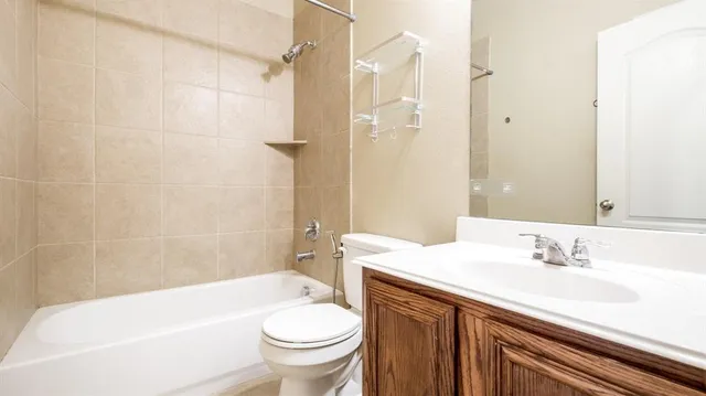 a bathroom with a sink a toilet and a bathtub
