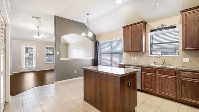 a spacious bathroom with a sink vanity and mirror