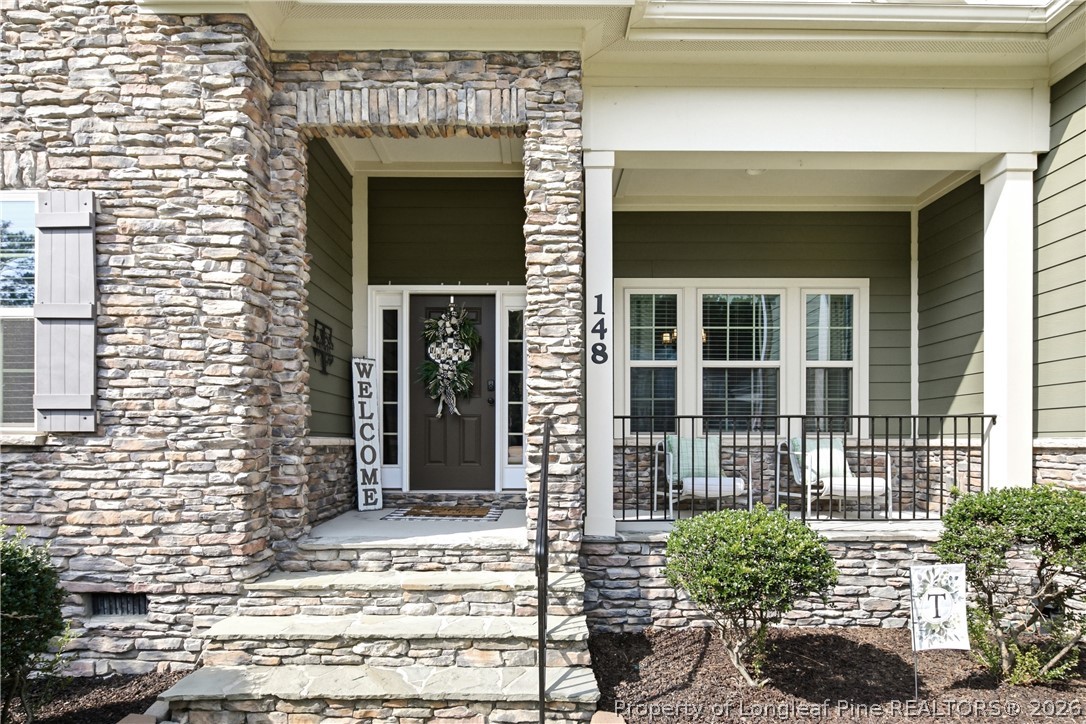 148 Heatherspring Way Spring Lake, NC 28390 - Photo 4 of 50 a front view of a house with a garden