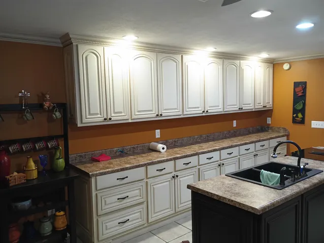 a kitchen with cabinets counter space and a sink