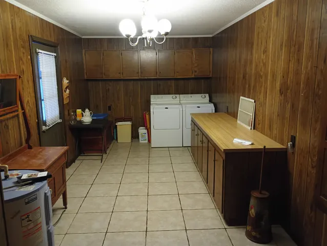a room with a cabinets and appliances