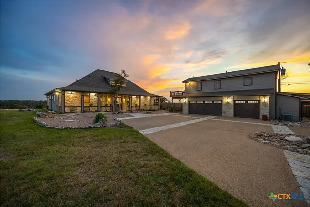 a view of house with outdoor space and sitting area
