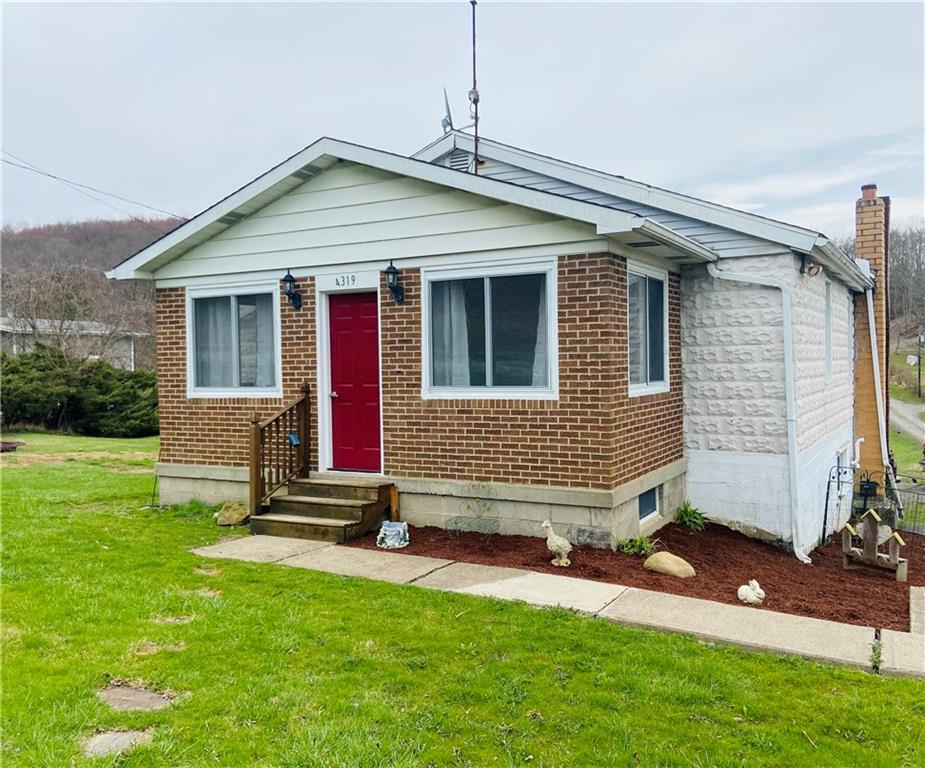 4319 Rte 908 Natrona Heights, PA 15065 - Photo 1 of 24 a front view of a house with a yard