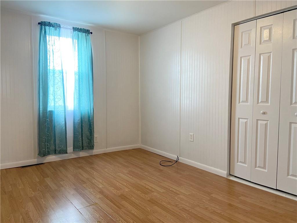 4319 Rte 908 Natrona Heights, PA 15065 - Photo 11 of 24 a view of an empty room with wooden floor and a window