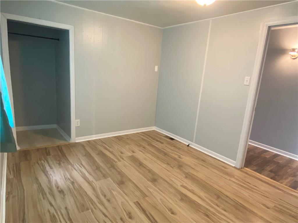 4319 Rte 908 Natrona Heights, PA 15065 - Photo 9 of 24 a view of empty room with wooden floor