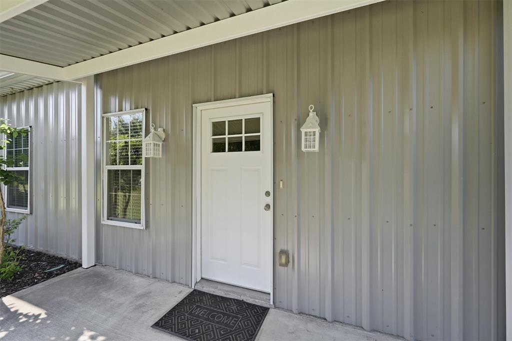 15656 South State Highway 78 Blue Ridge, TX 75424 - Photo 9 of 36 a view of a door and wooden floor