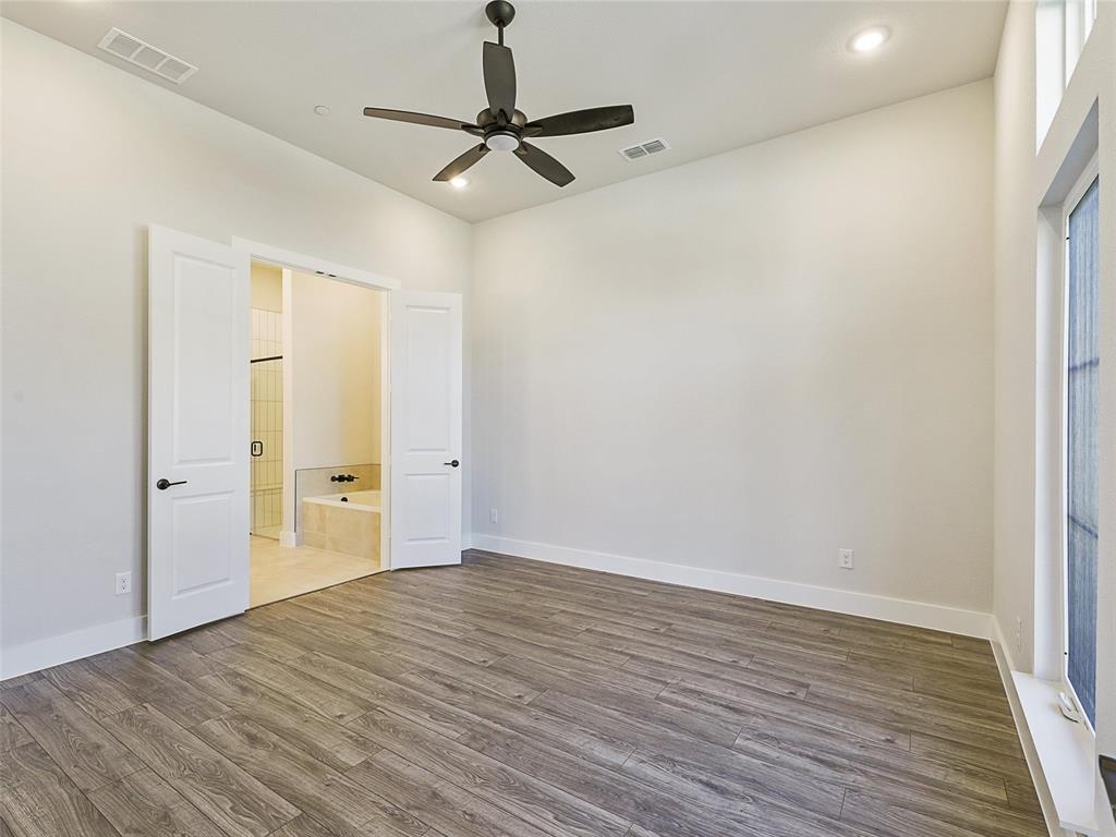 4299 Reeder Rdg Way Frisco, TX 75033 - Photo 14 of 30 a view of a room with wooden floor and natural light
