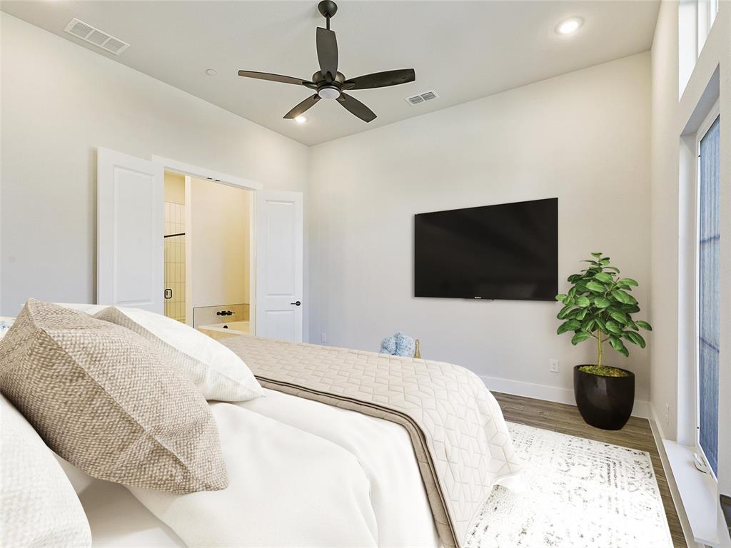 4299 Reeder Rdg Way Frisco, TX 75033 - Photo 15 of 30 a bedroom with a bed and a flat screen tv