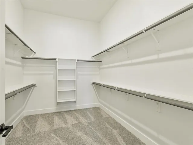 a view of an empty walk in closet