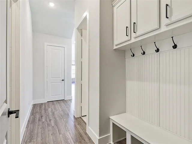a view of a room with wooden floor