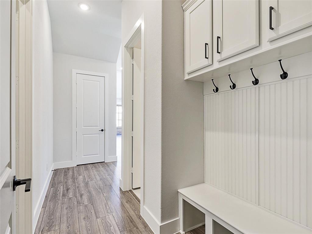 4299 Reeder Rdg Way Frisco, TX 75033 - Photo 21 of 30 a view of a room with wooden floor
