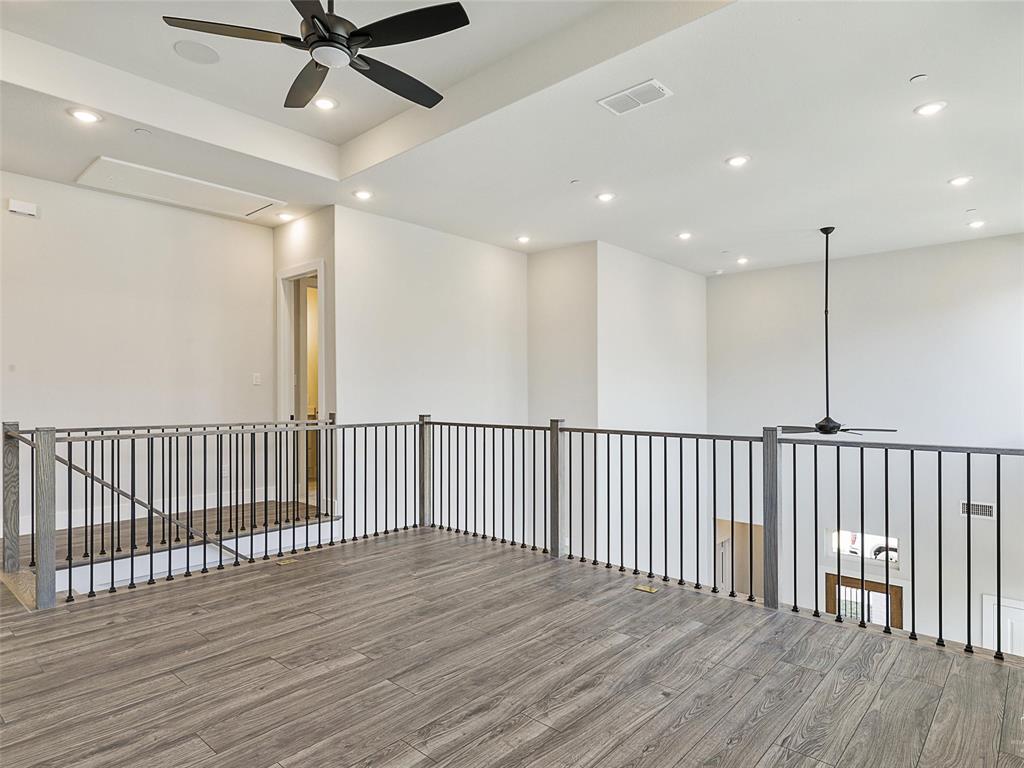 4299 Reeder Rdg Way Frisco, TX 75033 - Photo 24 of 30 a view of a hallway with wooden floor