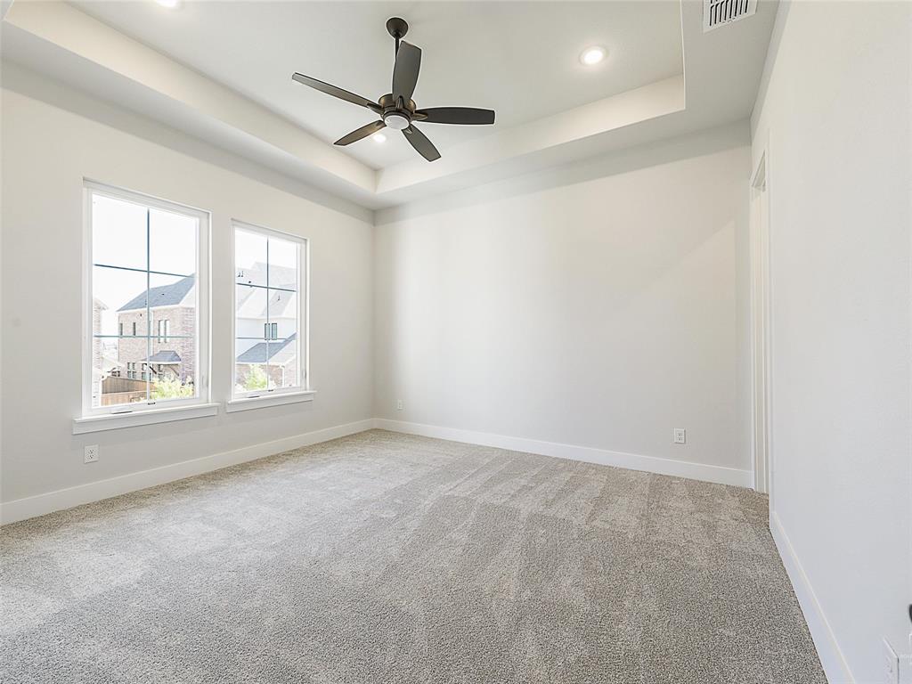 4299 Reeder Rdg Way Frisco, TX 75033 - Photo 26 of 30 an empty room with a window and a fan