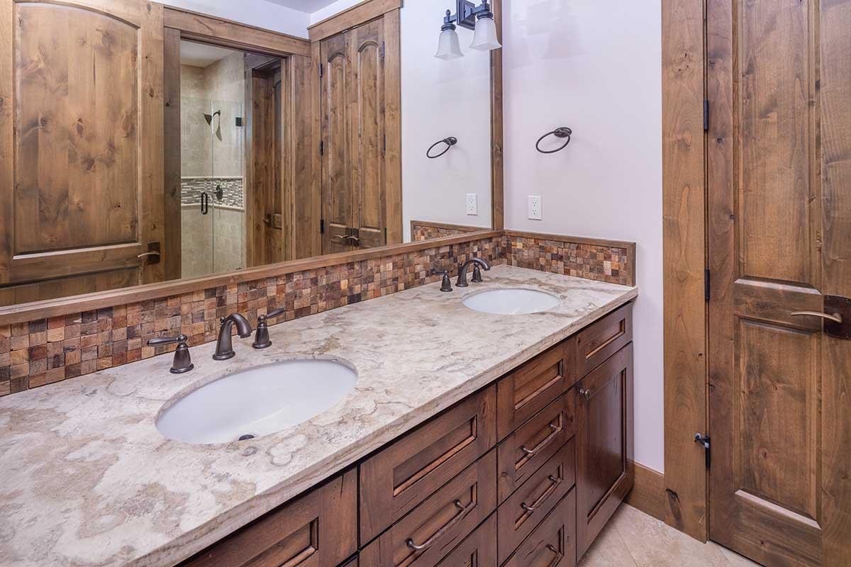 10606 Dutton Court Truckee, CA 96161 - Photo 13 of 22 a bathroom with a granite countertop sink and a mirror