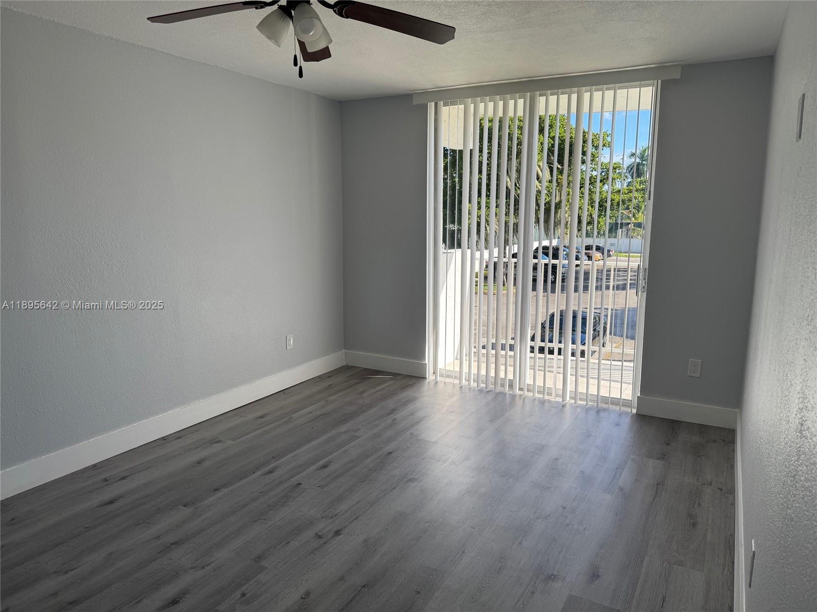 494 Northwest 165th Street, Unit C207 Miami, FL 33169 - Photo 11 of 14 a view of entryway with wooden floor