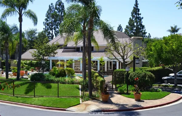 a front view of house and yard with green space