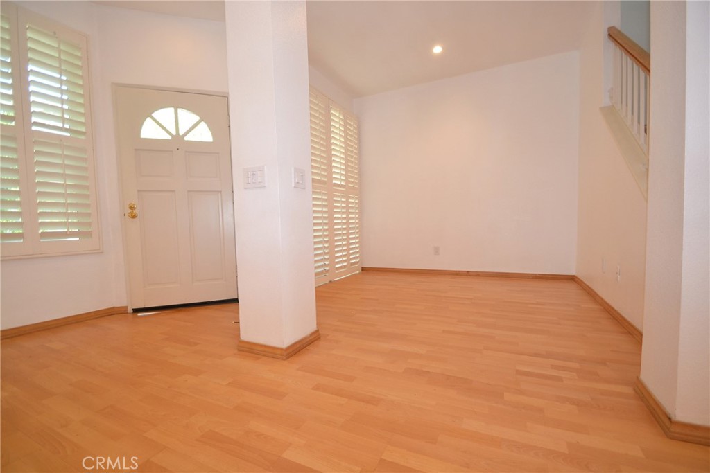 2615 Plaza Del Amo, Unit 636 Torrance, CA 90503 - Photo 5 of 22 an empty room with wooden floor and windows