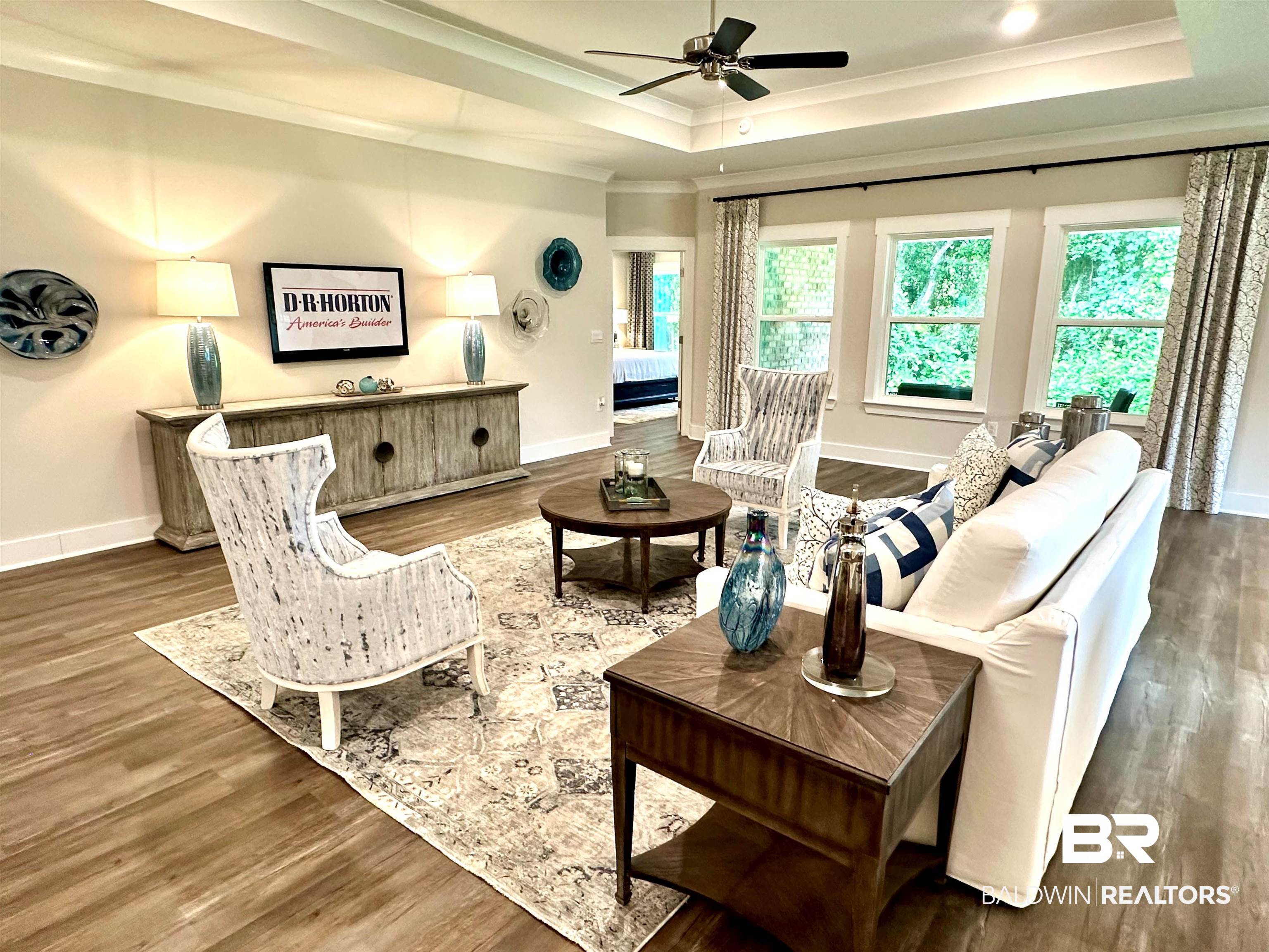 370 Barndling Street Fairhope, AL 36532 - Photo 10 of 30 Living room with ceiling fan, hardwood / wood-style flooring, and a raised ceiling