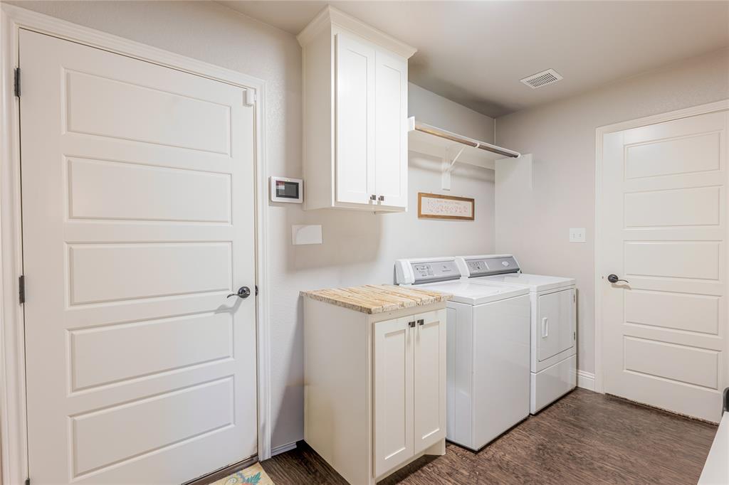 470 Wilson Bend Road Millsap, TX 76066 - Photo 15 of 39 a utility room with cabinets washer and dryer