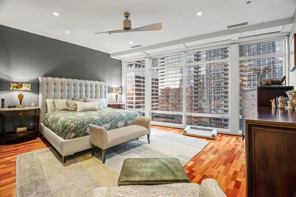 a bedroom with a bed and lamp