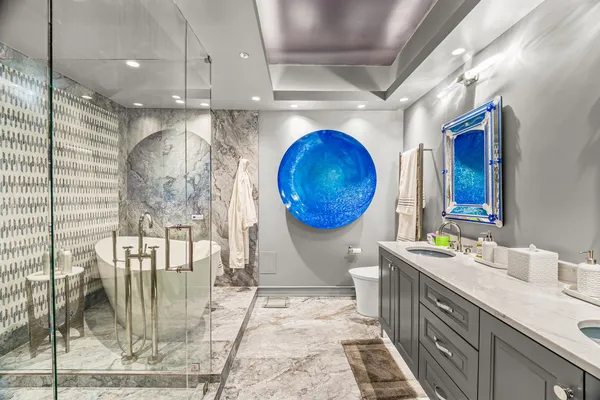 a bathroom with a double vanity sink and a mirror