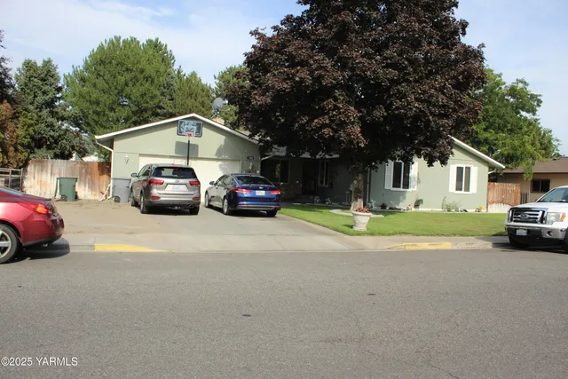 a car parked in front of a house