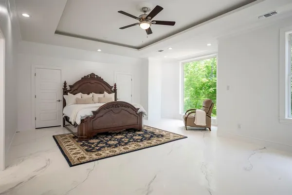 a bathroom with a bathtub and shower