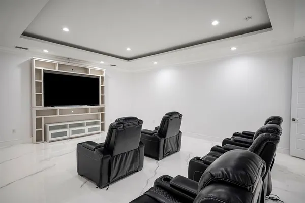 a living room with furniture a window and gym equipment