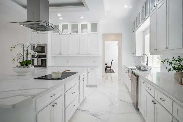 a kitchen with cabinets and white appliances