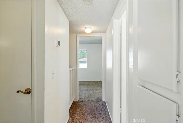 a view of a bathroom from a hallway