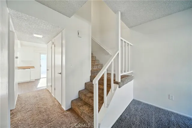 a view of a hallway with staircase