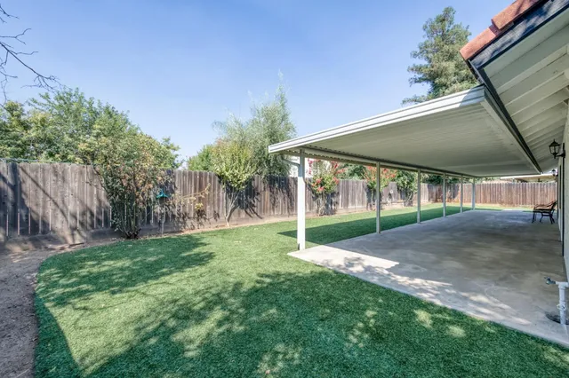 a view of a back yard with green space