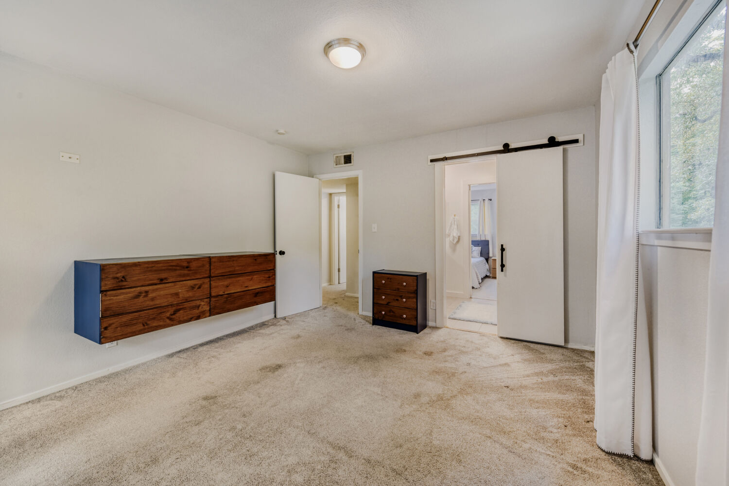 1912 Lightsey Road, Unit 6 Austin, TX 78704 - Photo 17 of 27 an empty room with furniture and a window