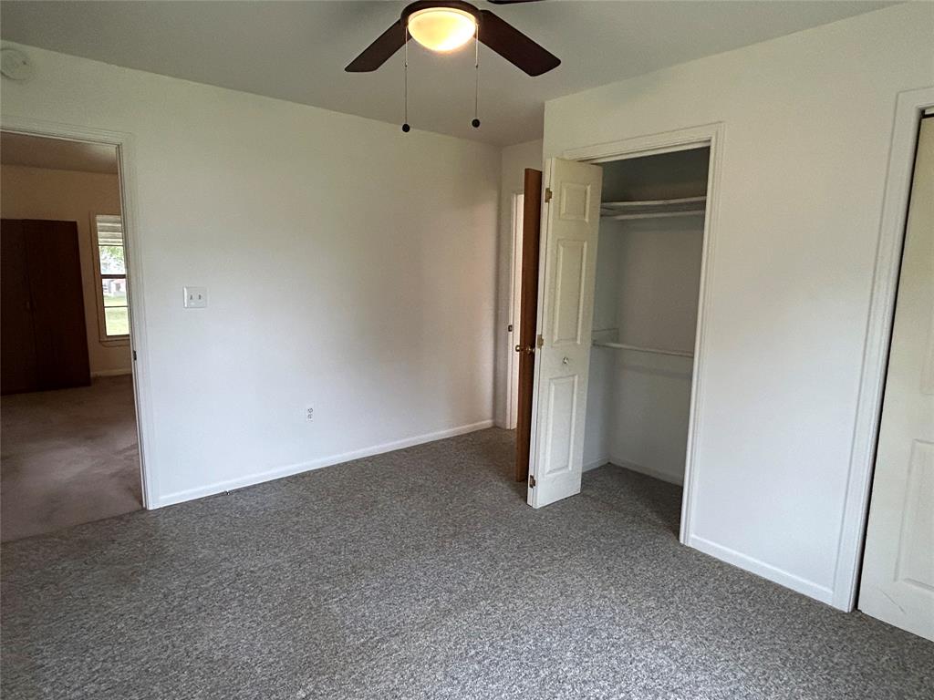 302 North Commerce Savoy, TX 75479 - Photo 14 of 32 an empty room with closet area