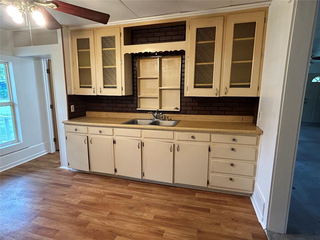 302 North Commerce Savoy, TX 75479 - Photo 16 of 32 a view of a kitchen with a sink
