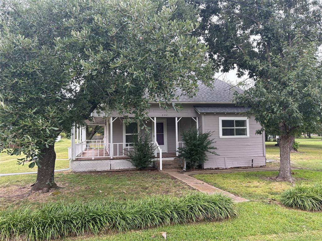 302 North Commerce Savoy, TX 75479 - Photo 2 of 32 front view of a house with a yard