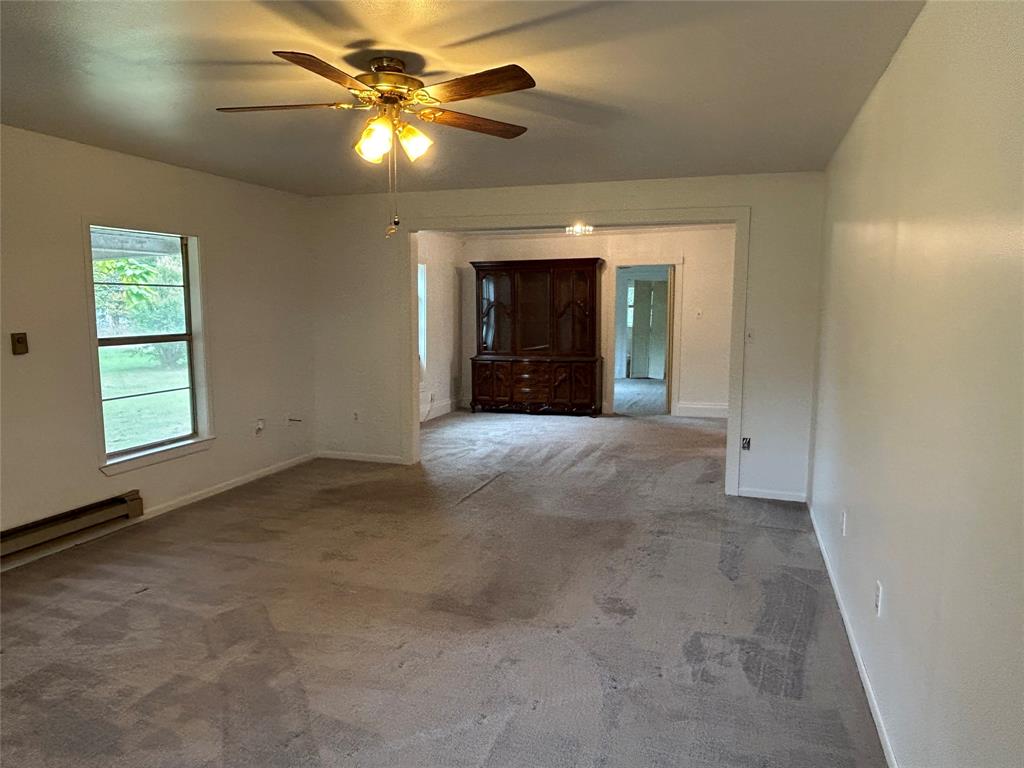 302 North Commerce Savoy, TX 75479 - Photo 26 of 32 en view interior of a house with a chandelier fan