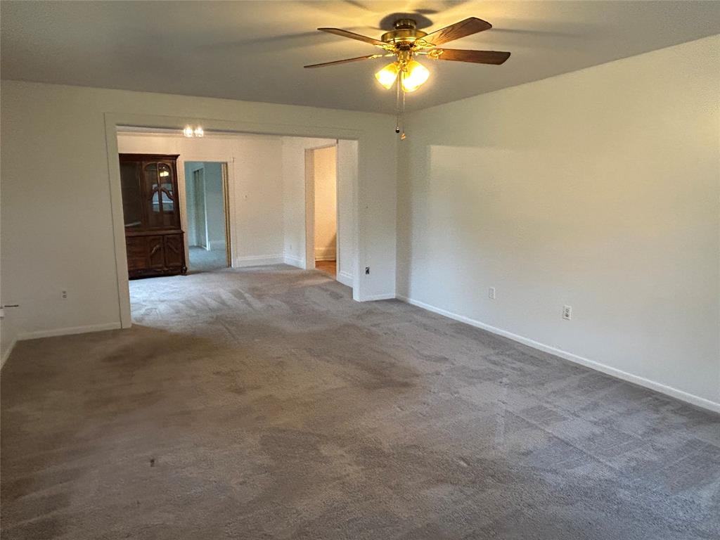 302 North Commerce Savoy, TX 75479 - Photo 27 of 32 a view of an empty room with a window