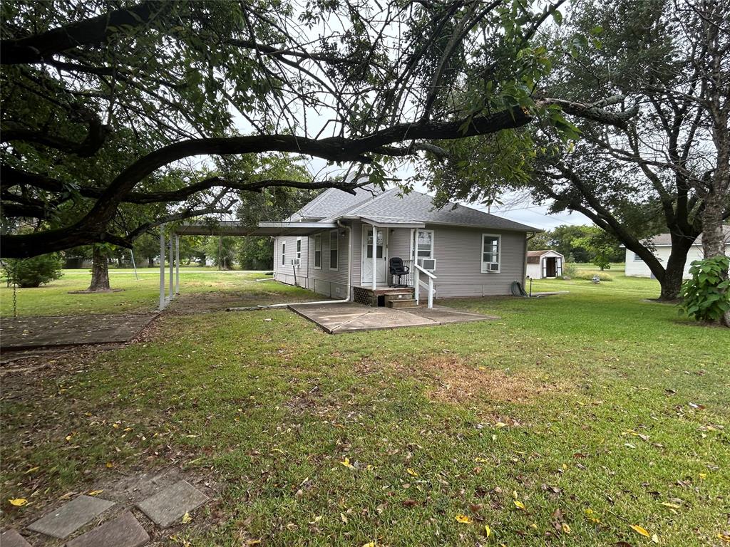 302 North Commerce Savoy, TX 75479 - Photo 29 of 32 a front view of a house with a yard