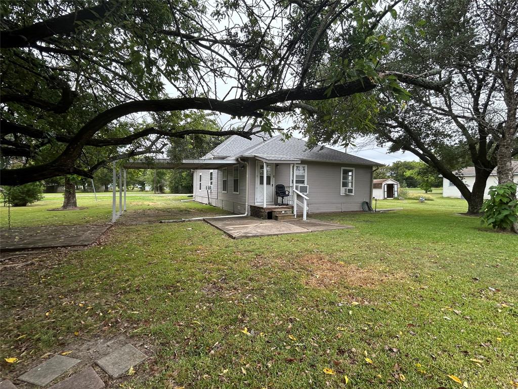 302 North Commerce Savoy, TX 75479 - Photo 30 of 32 a front view of a house with a yard