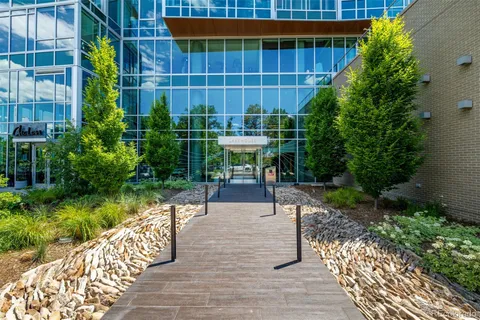 a view of a chairs and table on the wooden deck
