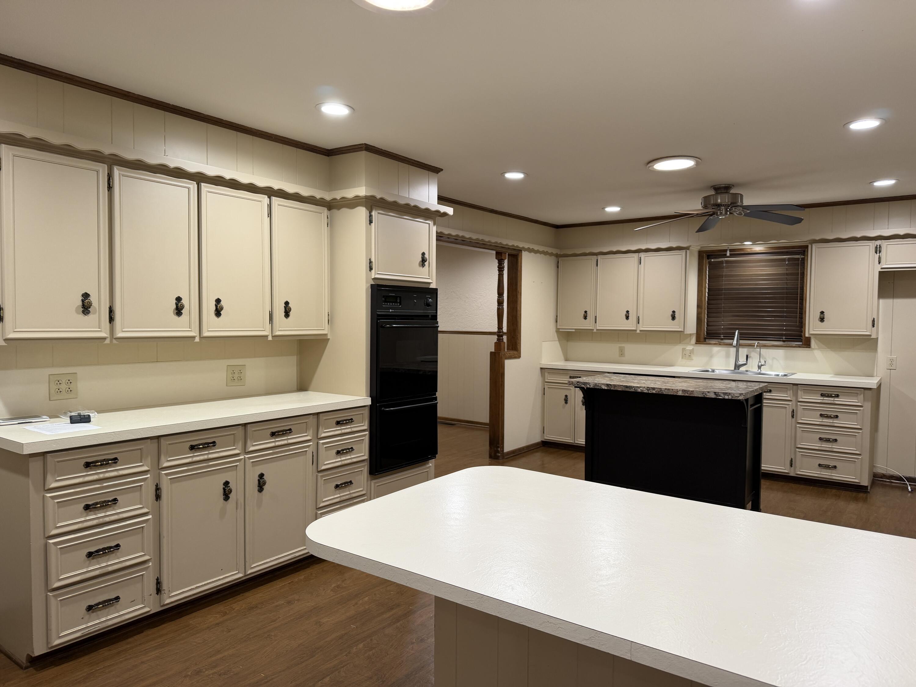 1603 South 8th Street Lamesa, TX 79331 - Photo 6 of 39 a large kitchen with cabinets