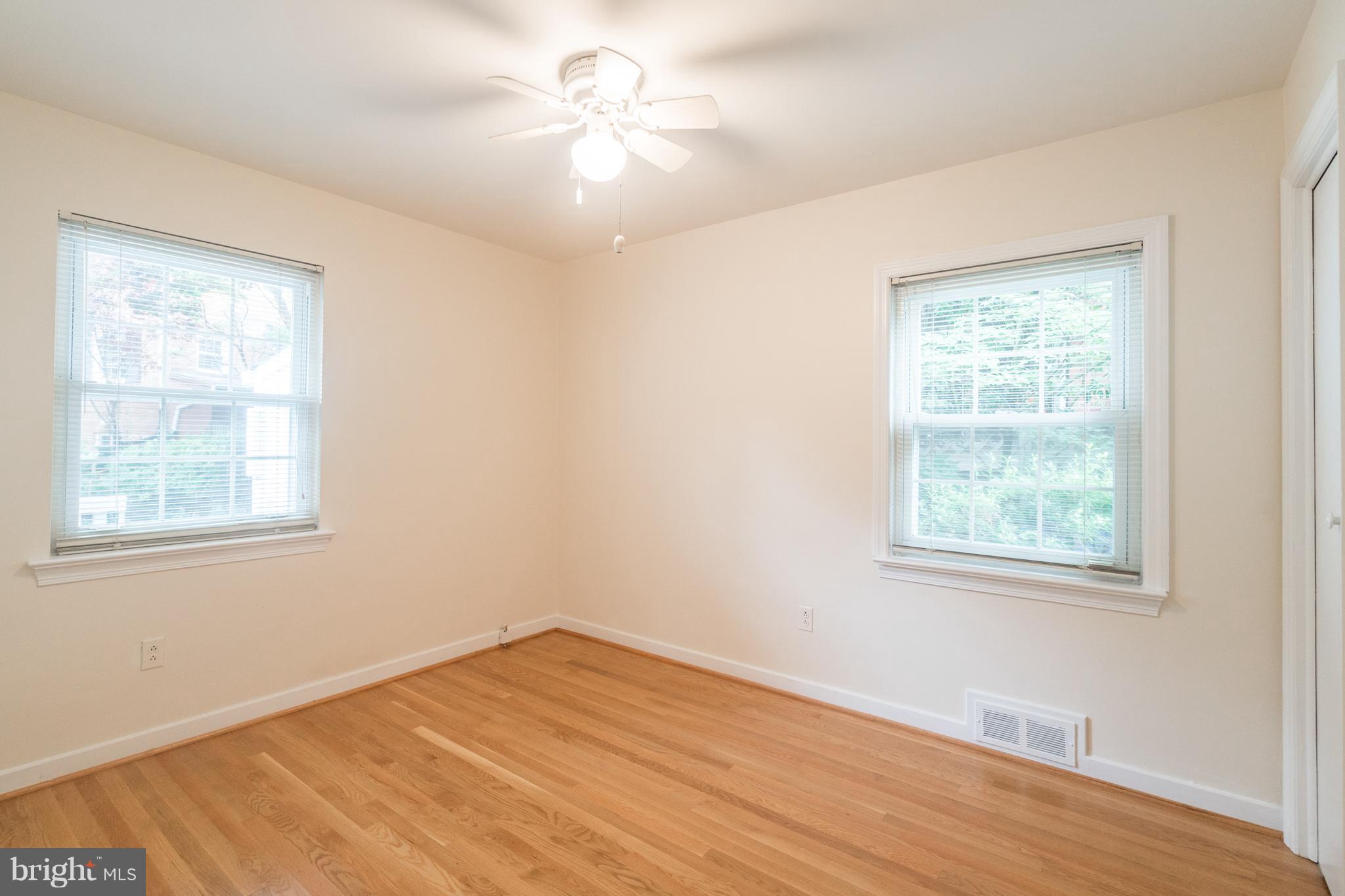6104 28th Street North Arlington, VA 22207 - Photo 15 of 30 a view of an empty room with wooden floor and a window